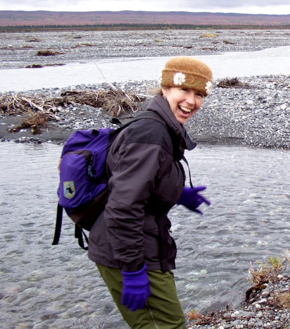 Felt hat fiber artist, Carrie Cahill Mulligan dances wildly on the banks of the McKinley River, hoping to fend off hypothermia while hiking in Denali National Park, Alaska, in early September, 2002.